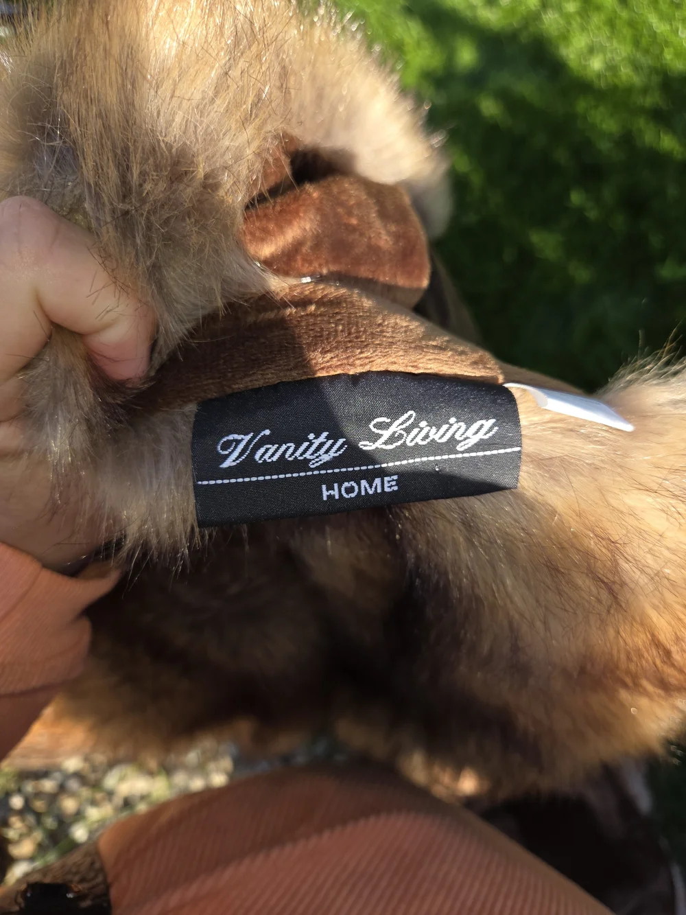 This is a brown faux fur item from the Vanity Living HOME brand.